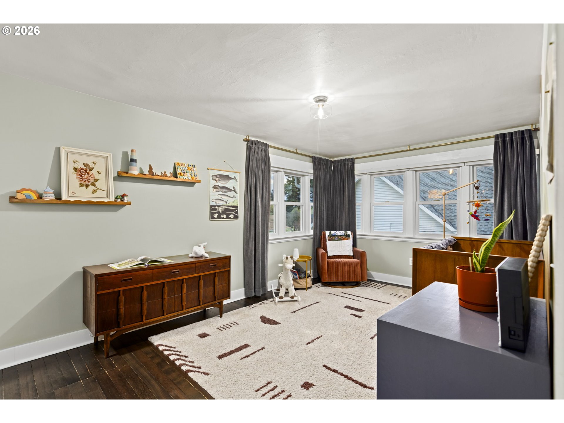 7123 Southeast Rhone Street Portland, OR 97206 - Photo 29 of 48 a living room with furniture and a flat screen tv