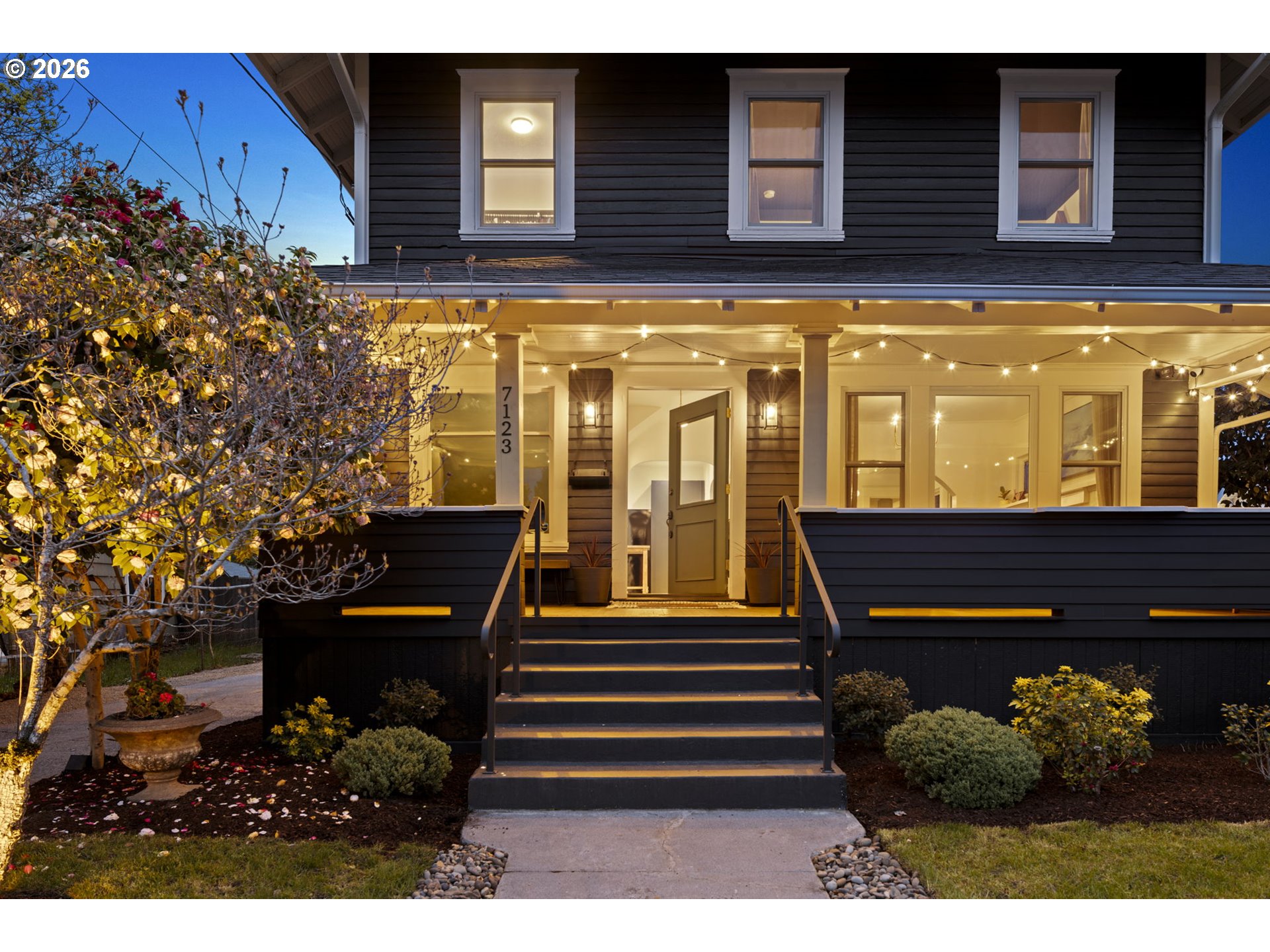 7123 Southeast Rhone Street Portland, OR 97206 - Photo 3 of 48 a view of a house with a balcony