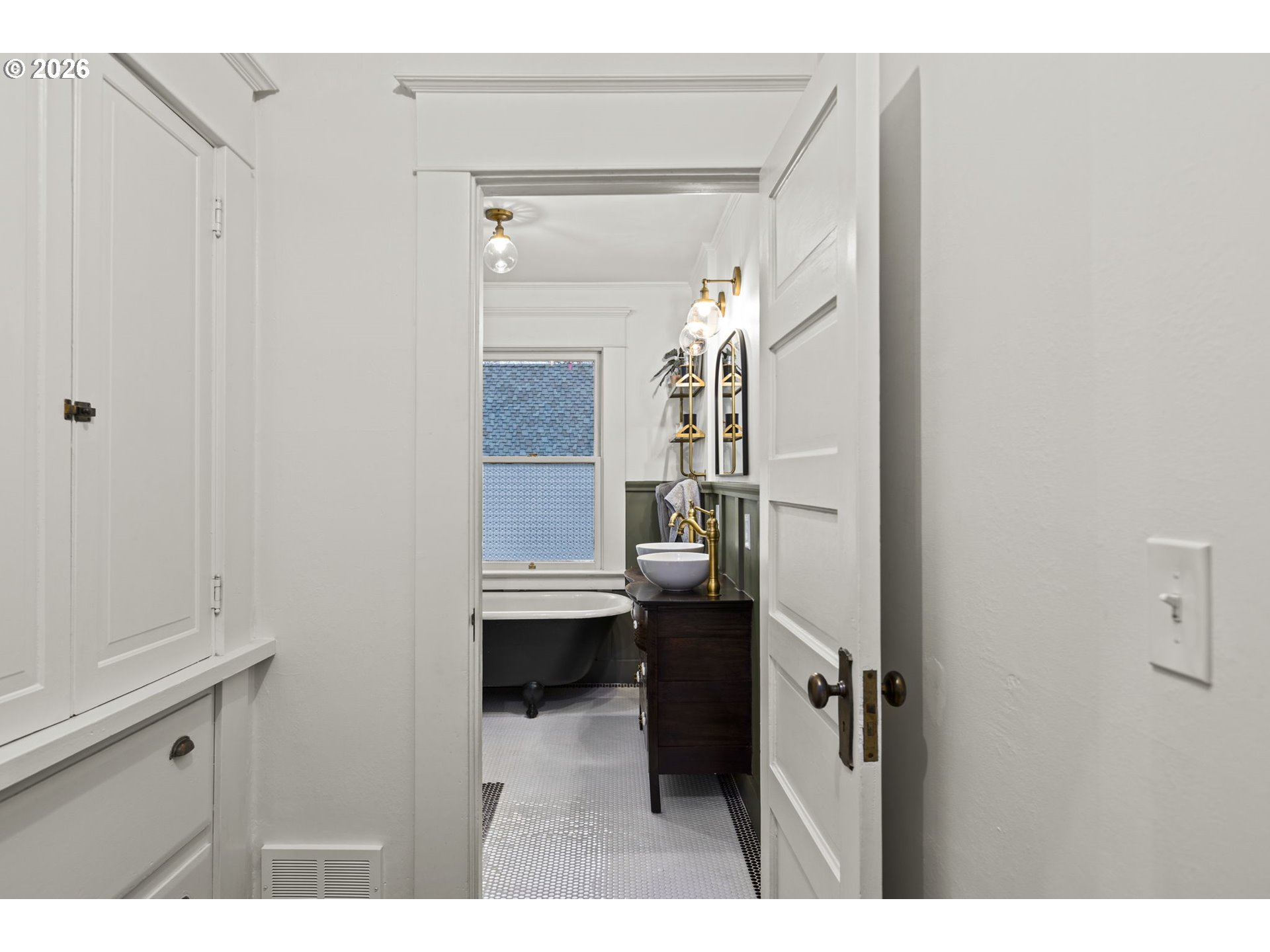 7123 Southeast Rhone Street Portland, OR 97206 - Photo 33 of 48 a view of bathroom with a sink and mirror