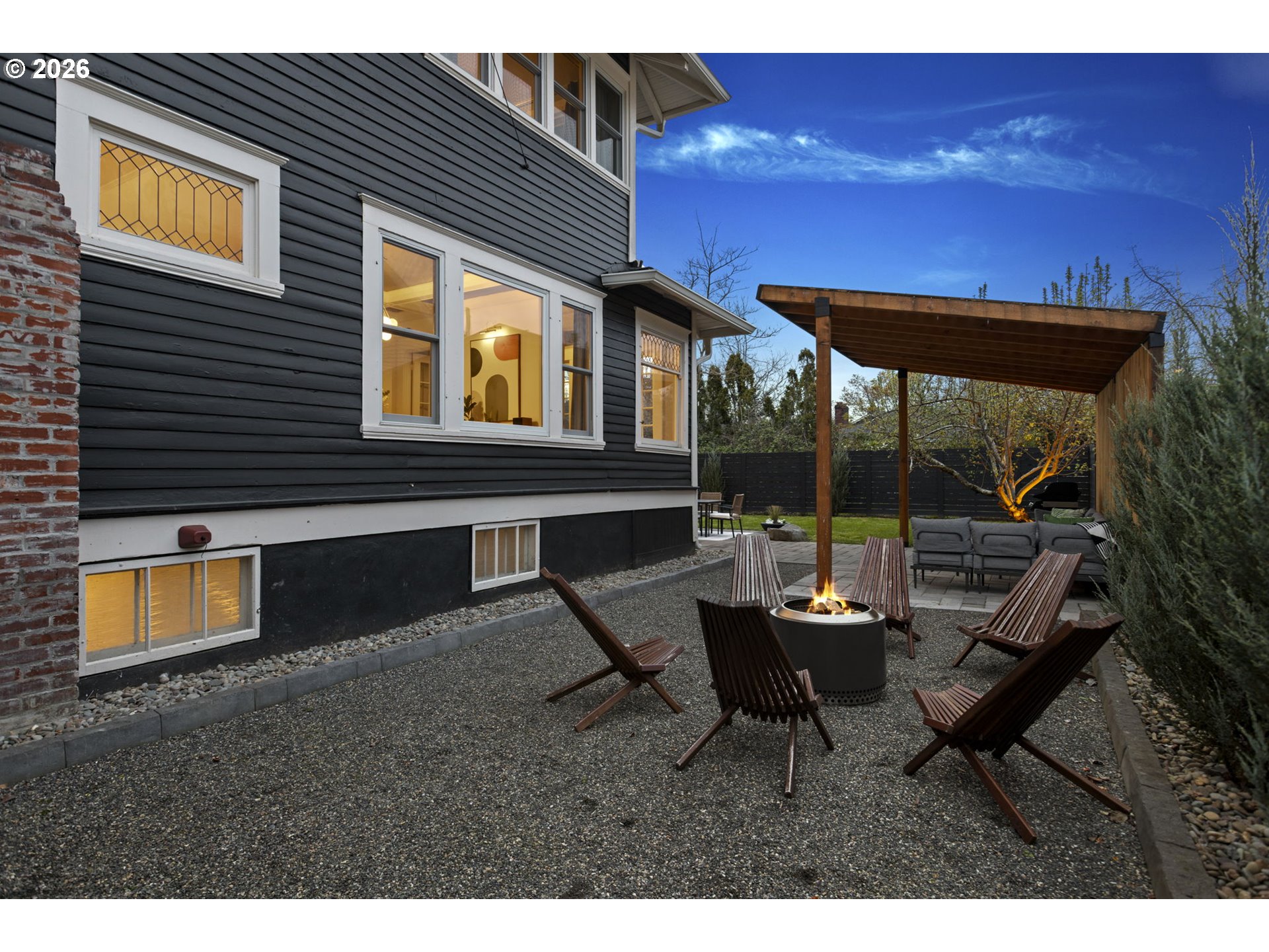 7123 Southeast Rhone Street Portland, OR 97206 - Photo 41 of 48 a backyard of a house with table and chairs