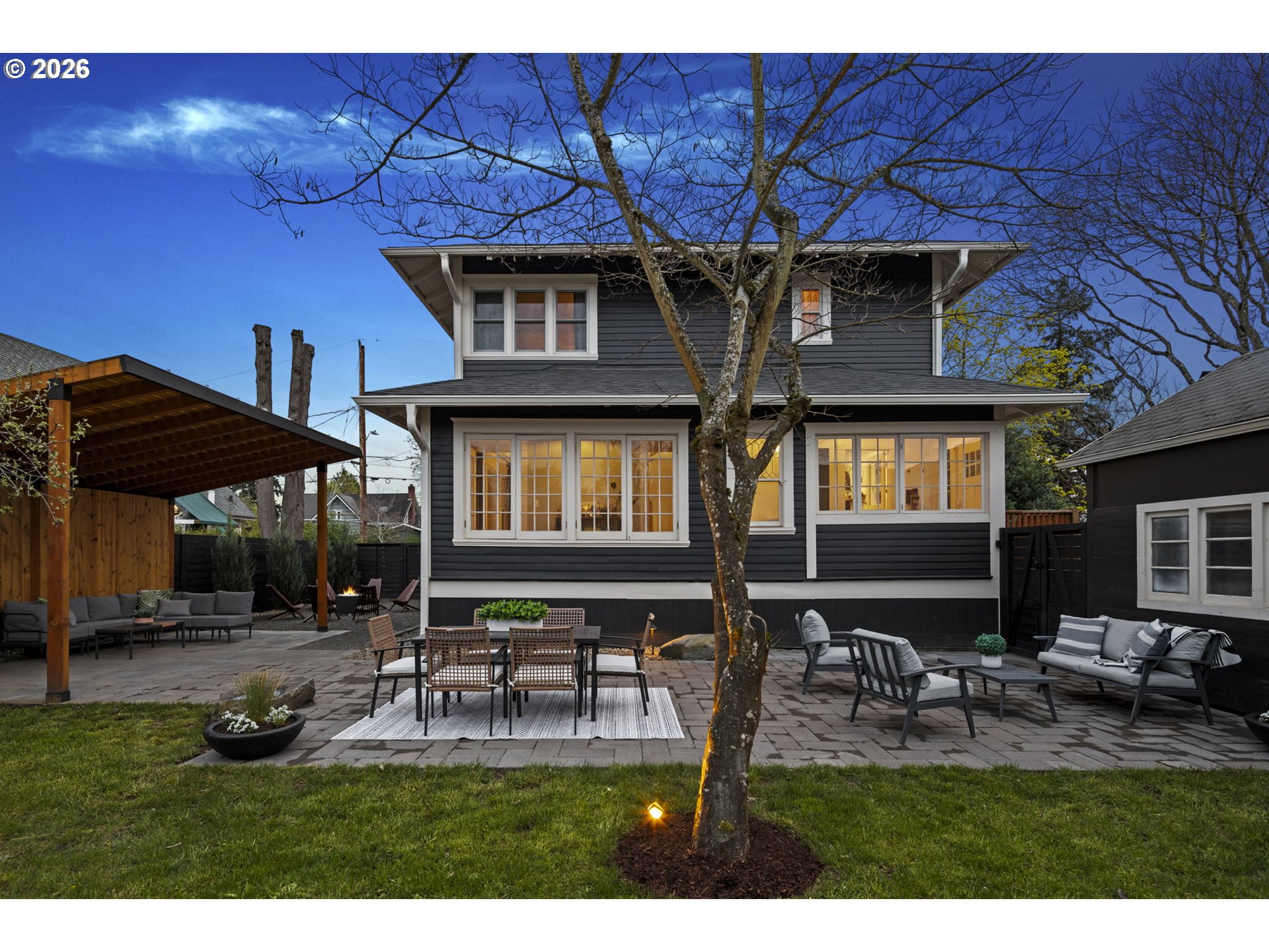 7123 Southeast Rhone Street Portland, OR 97206 - Photo 42 of 48 a backyard of a house with table and chairs
