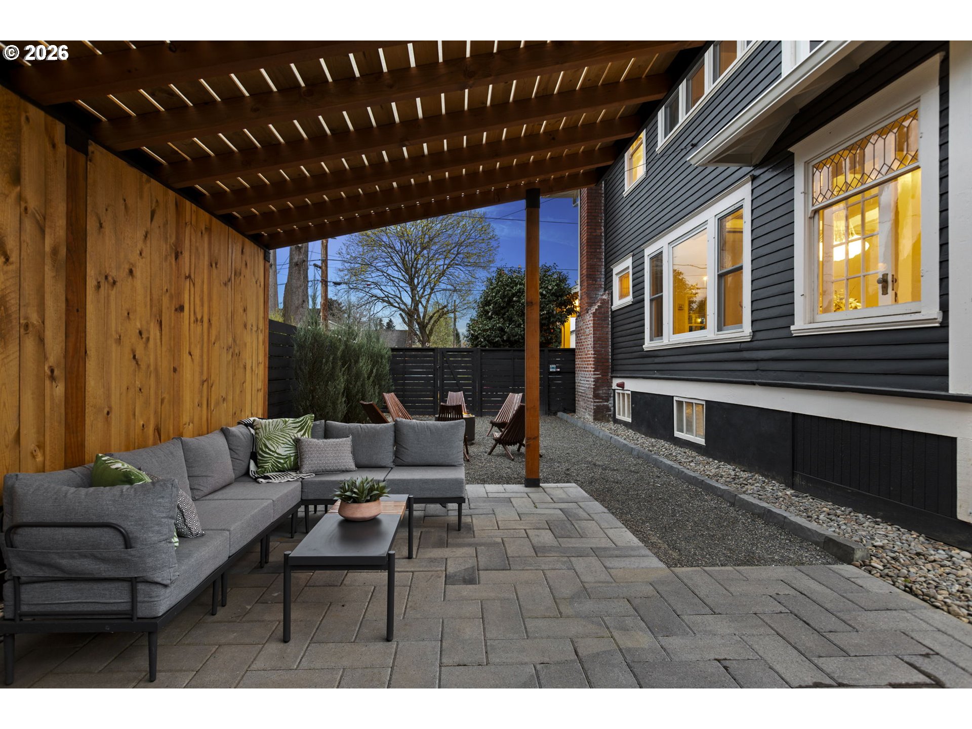 7123 Southeast Rhone Street Portland, OR 97206 - Photo 45 of 48 a living room with furniture a fireplace and a floor to ceiling window