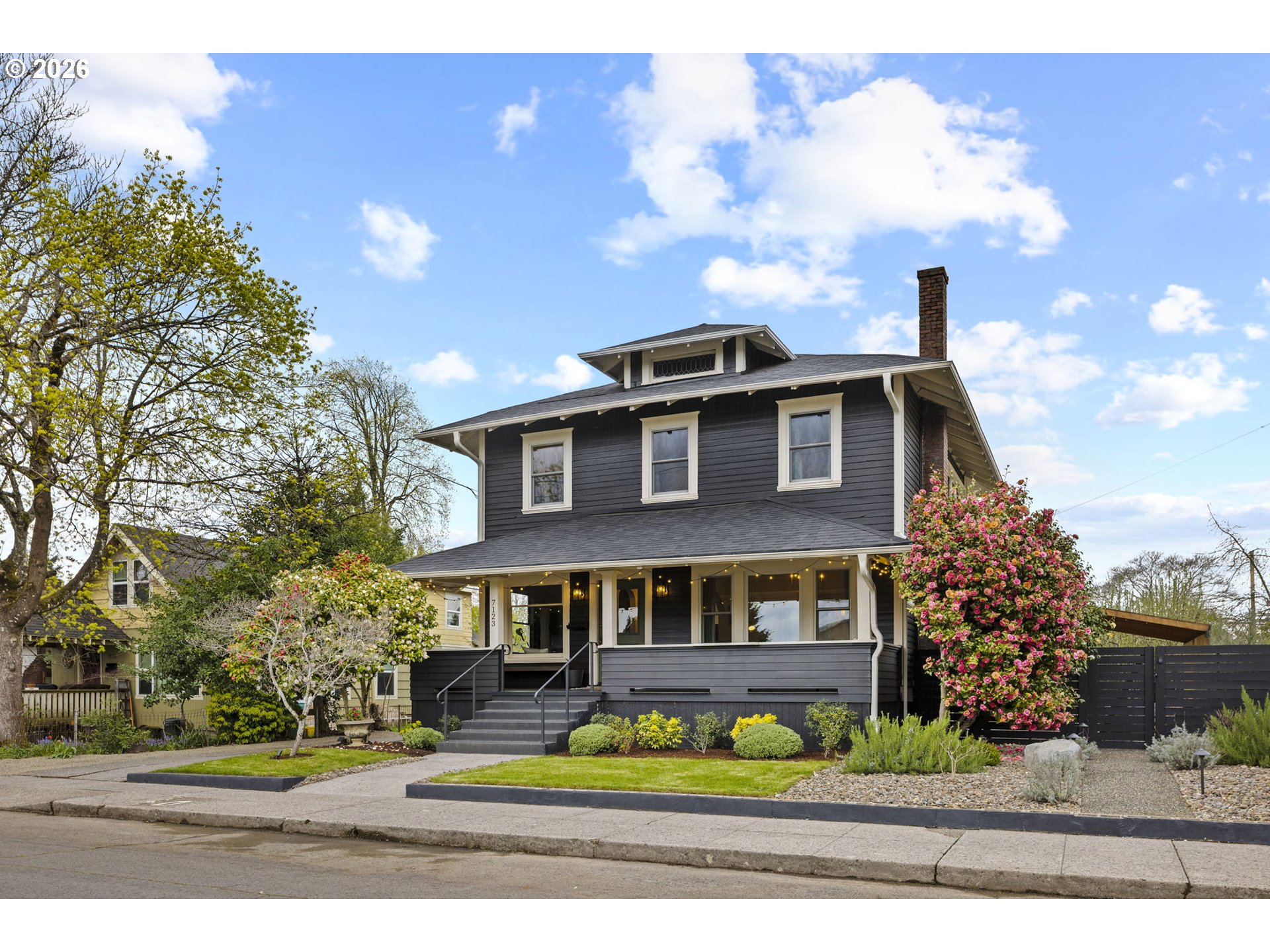 7123 Southeast Rhone Street Portland, OR 97206 - Photo 47 of 48 a front view of a house with garden