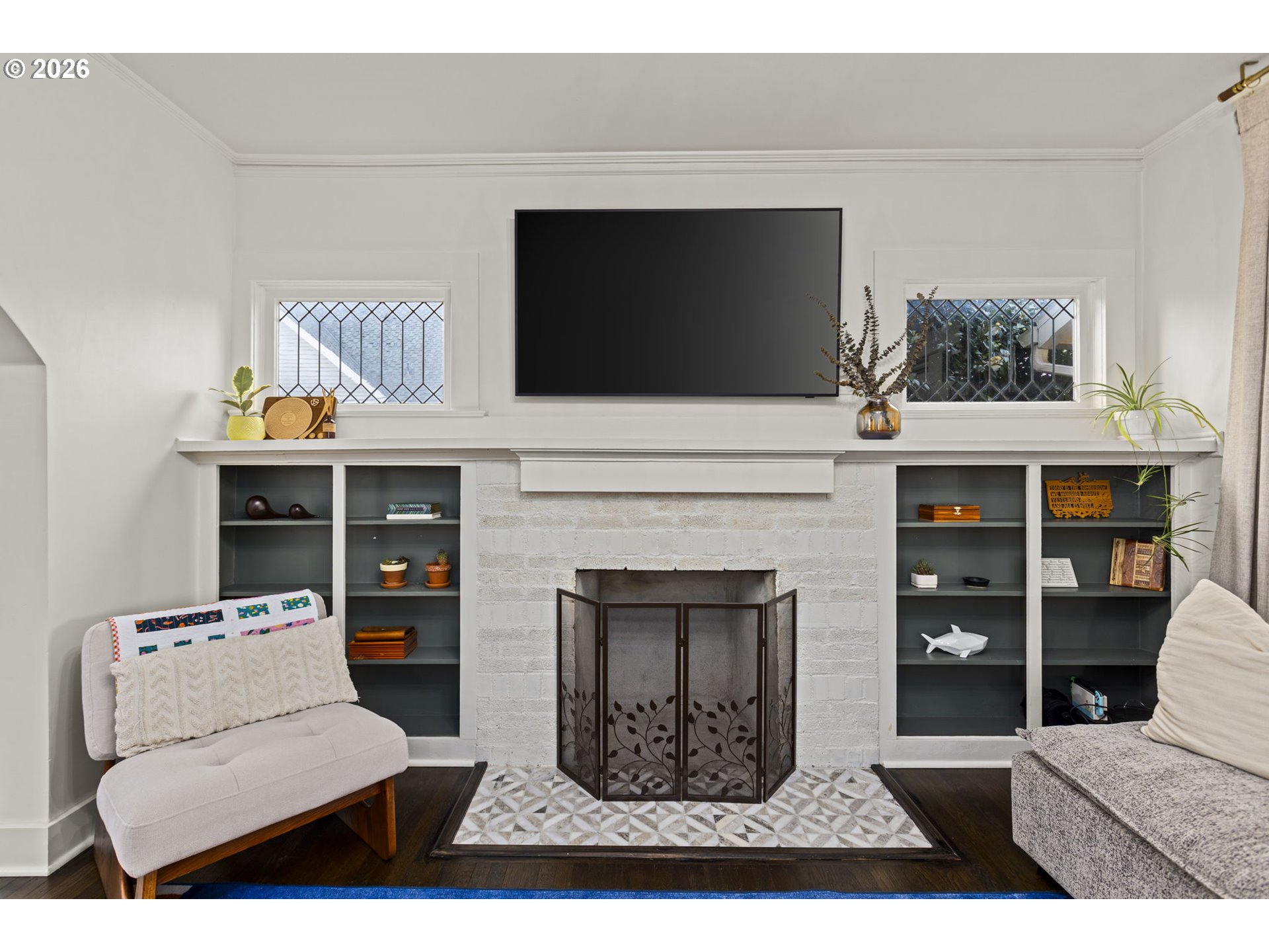 7123 Southeast Rhone Street Portland, OR 97206 - Photo 8 of 48 a living room with furniture and a fireplace