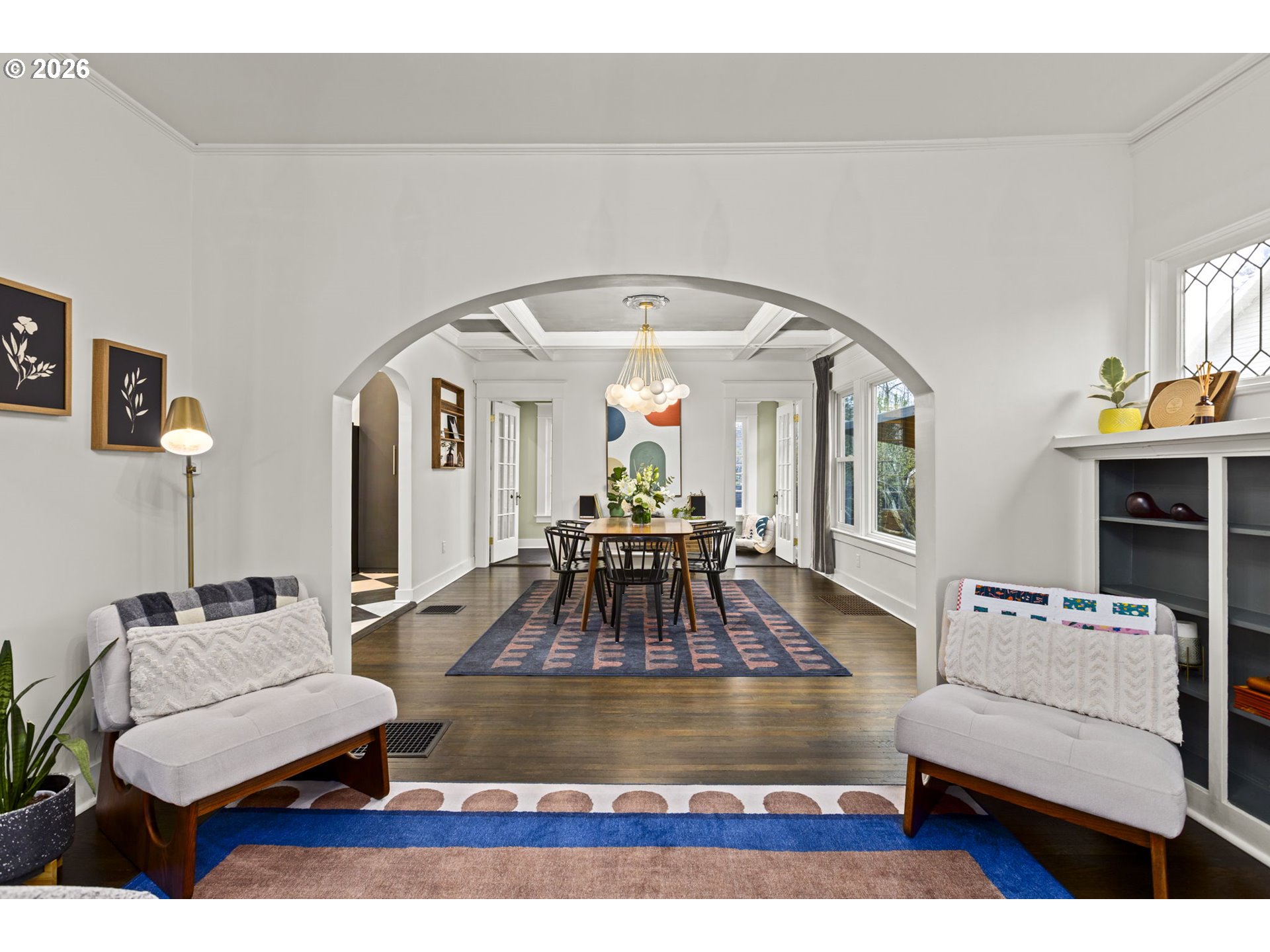 7123 Southeast Rhone Street Portland, OR 97206 - Photo 9 of 48 a living room with furniture and a chandelier