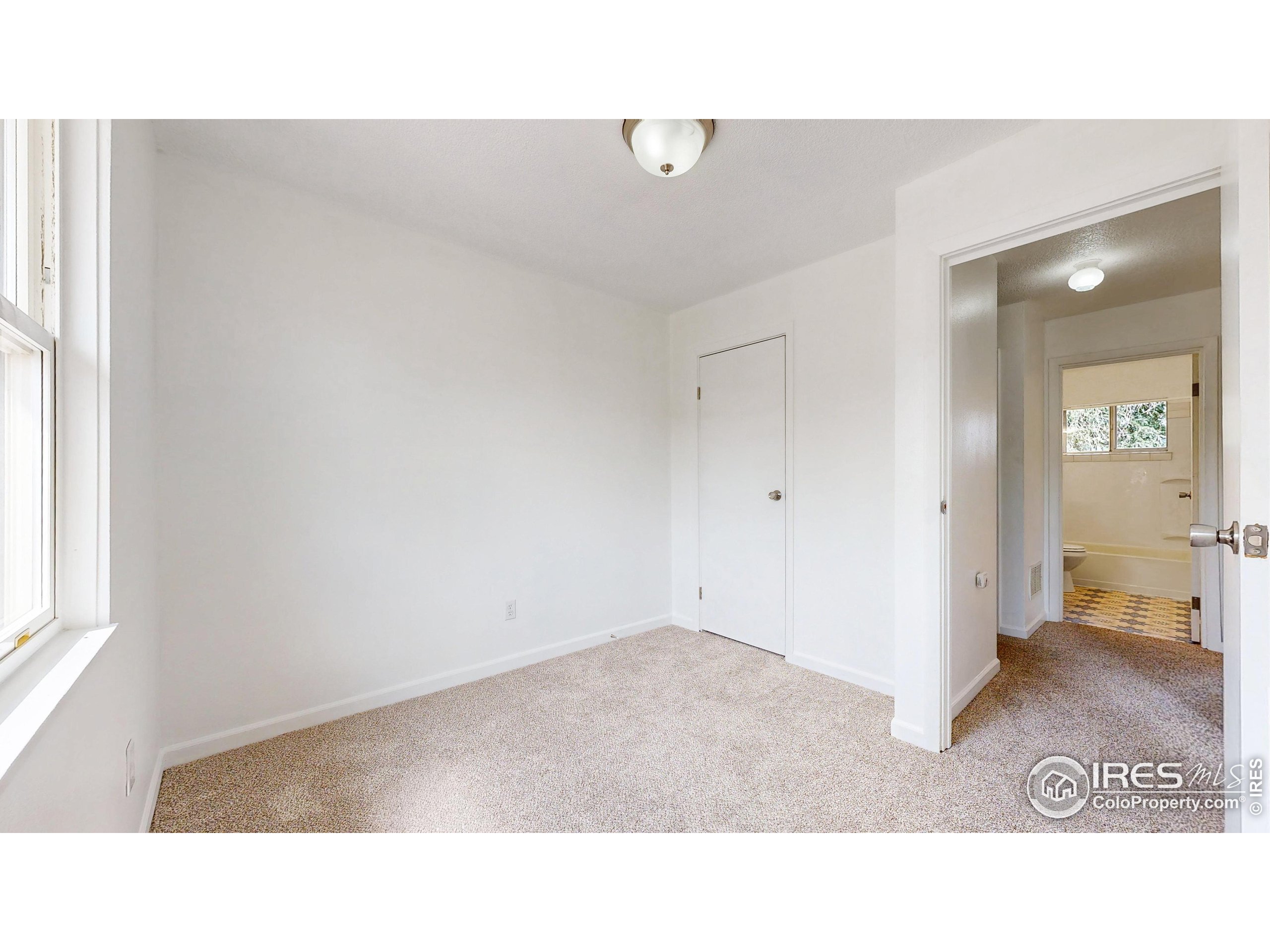 117 Fry Street Ault, CO 80610 - Photo 17 of 39 a open hall with wooden floor
