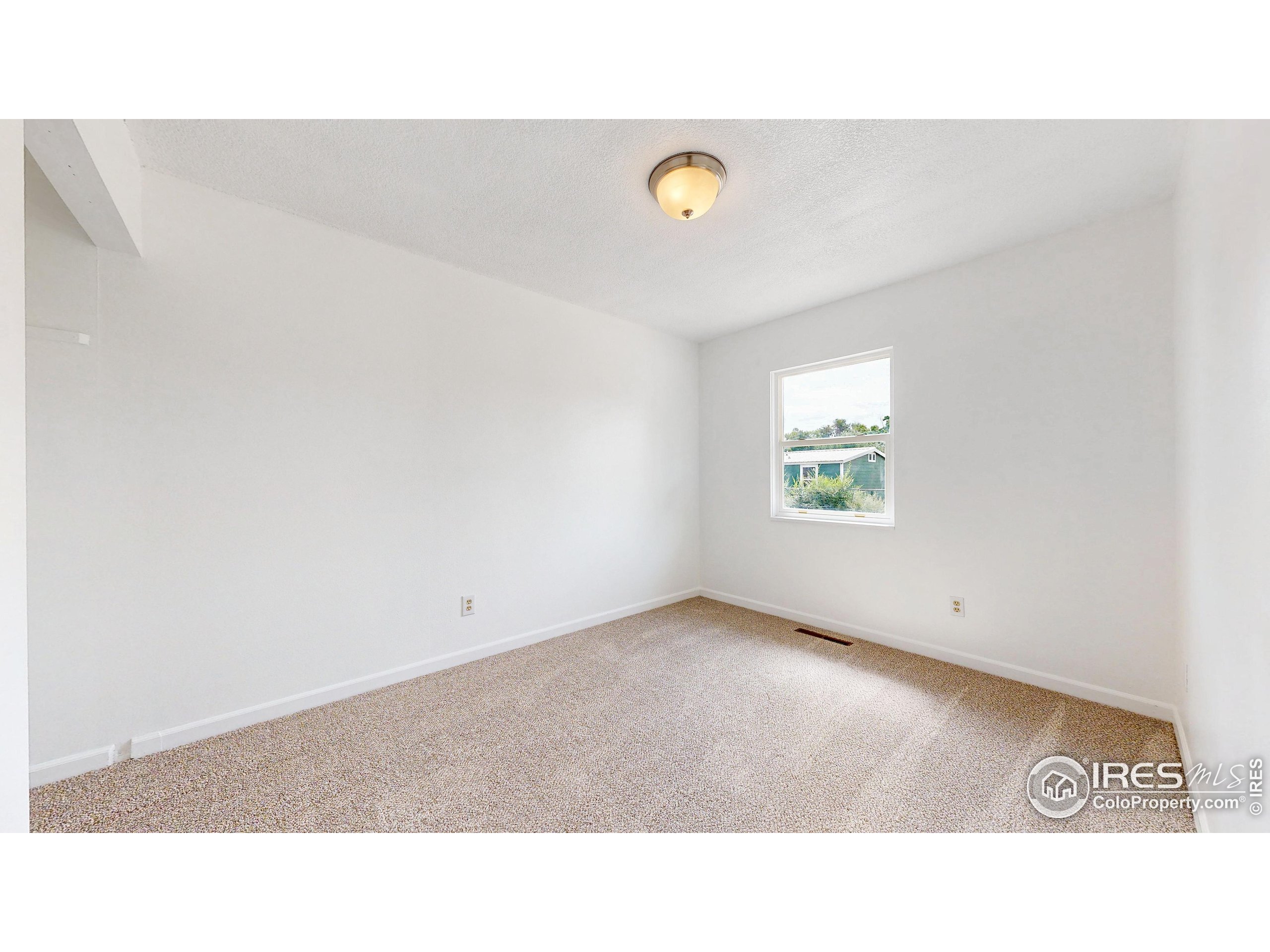 117 Fry Street Ault, CO 80610 - Photo 19 of 39 a open space with a window