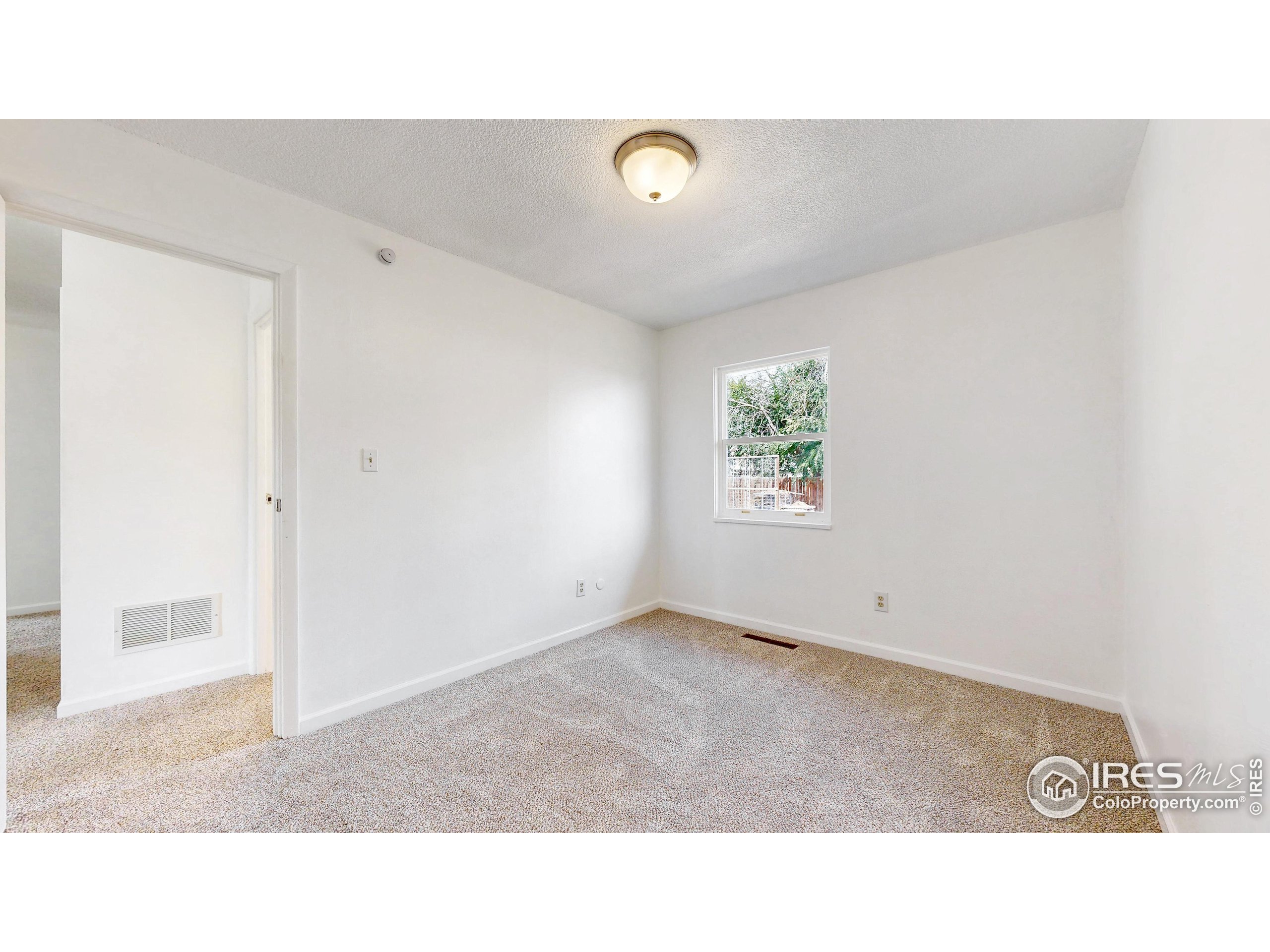 117 Fry Street Ault, CO 80610 - Photo 21 of 39 a black and white photo of a living room