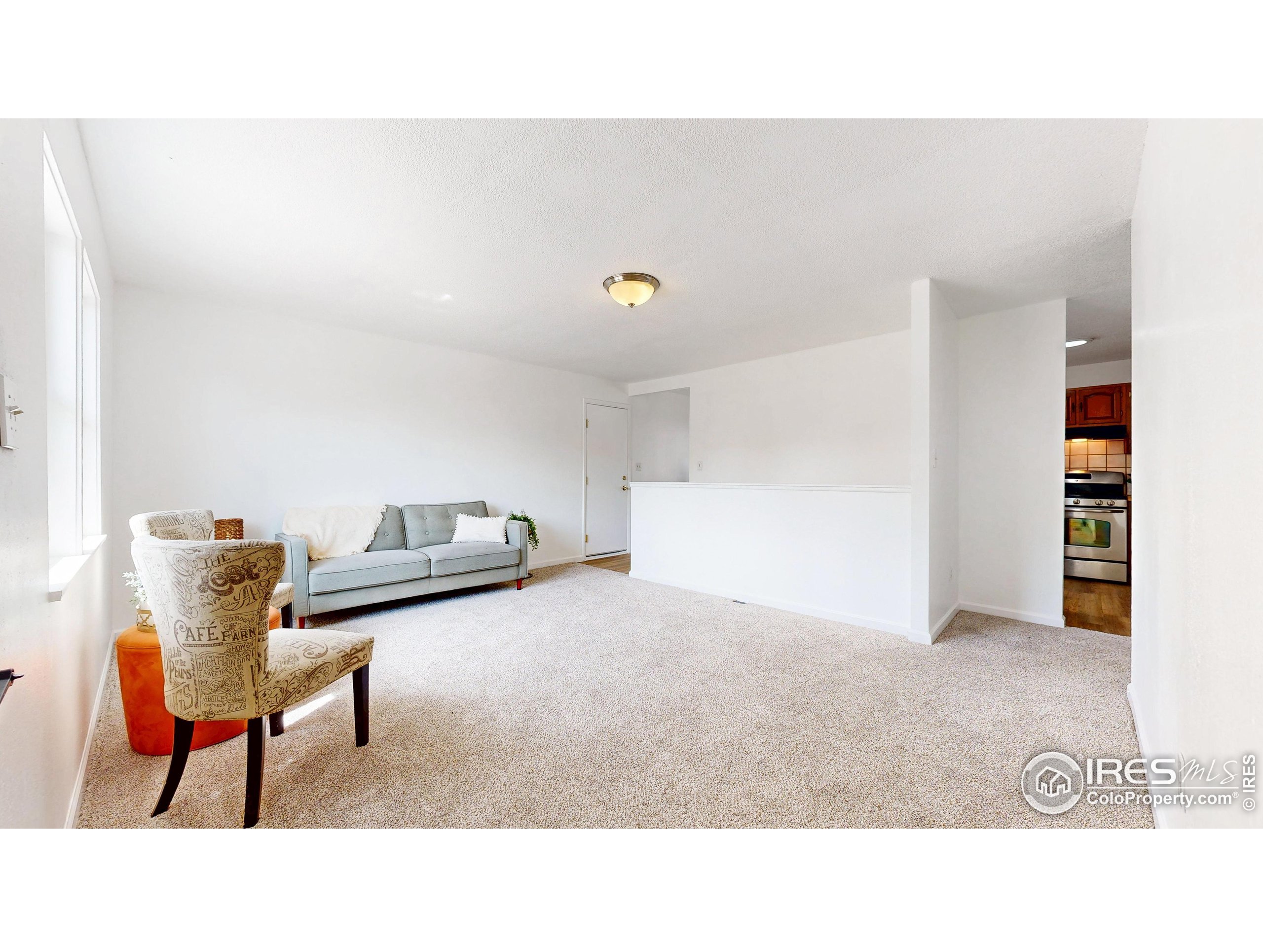 117 Fry Street Ault, CO 80610 - Photo 6 of 39 a living room with furniture and a table