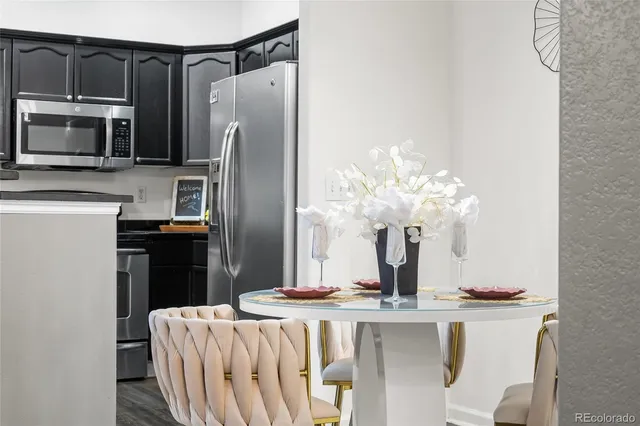 a kitchen with a refrigerator and microwave