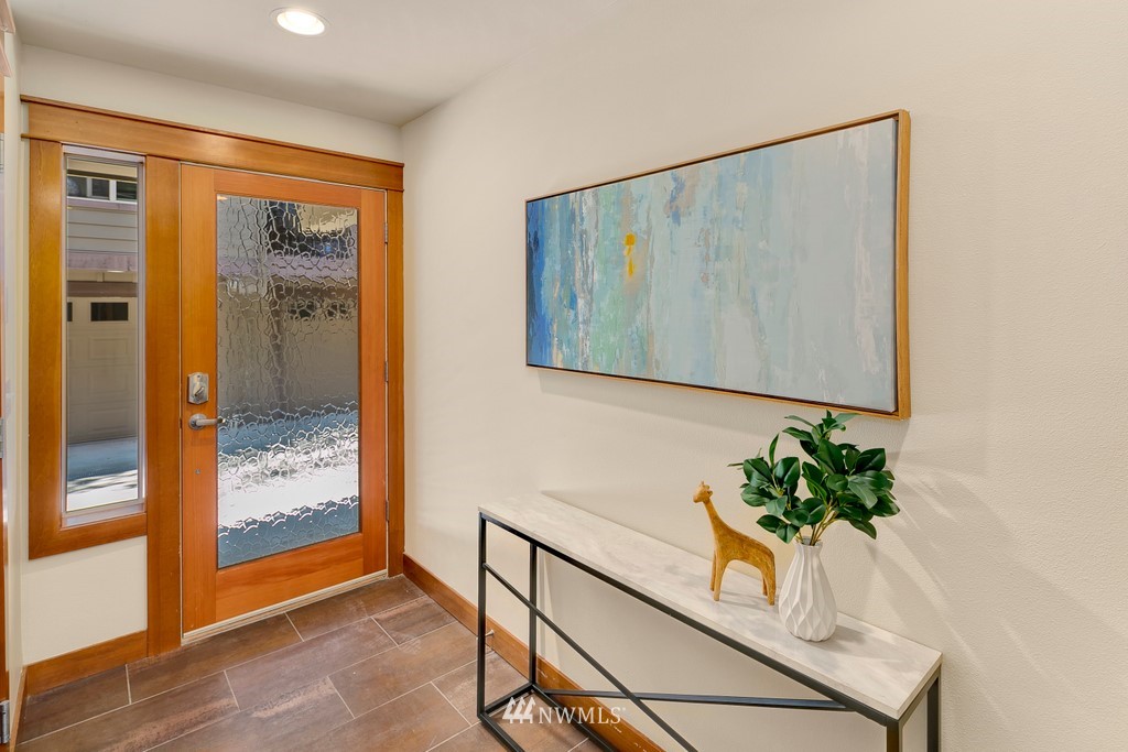 1717 18th Avenue, Unit B Seattle, WA 98122 - Photo 2 of 25 a view of hallway with paintings on the wall