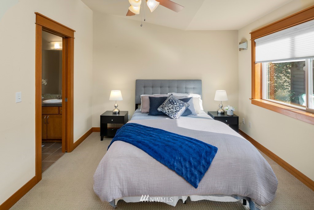 1717 18th Avenue, Unit B Seattle, WA 98122 - Photo 14 of 25 a bedroom with a bed and a window