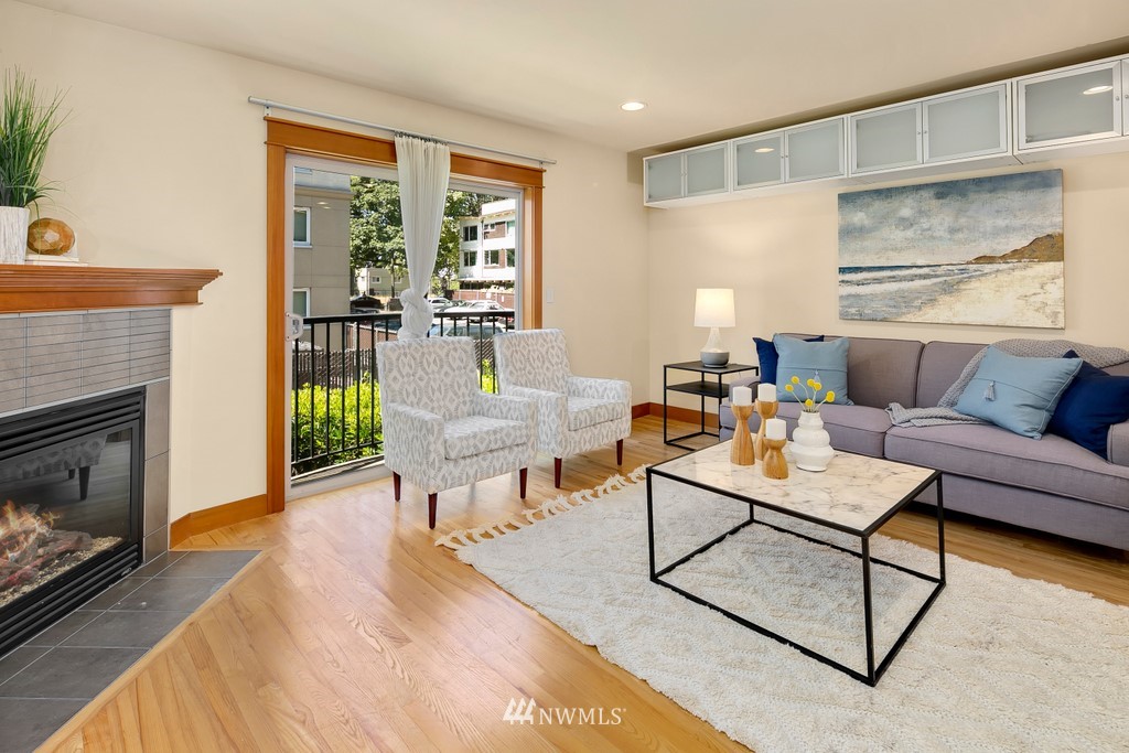 1717 18th Avenue, Unit B Seattle, WA 98122 - Photo 4 of 25 a living room with furniture and a fireplace