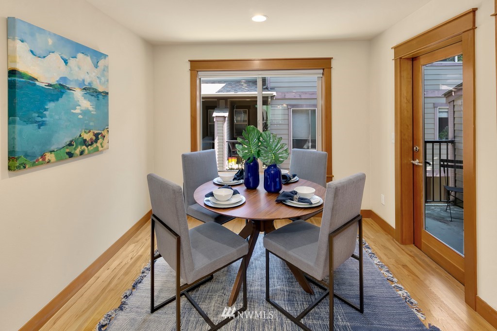 1717 18th Avenue, Unit B Seattle, WA 98122 - Photo 7 of 25 a view of a dining room with furniture window and wooden floor