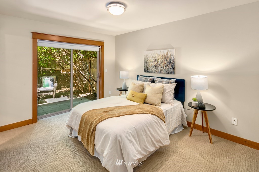 1717 18th Avenue, Unit B Seattle, WA 98122 - Photo 10 of 25 a bed sitting in a bedroom next to a window
