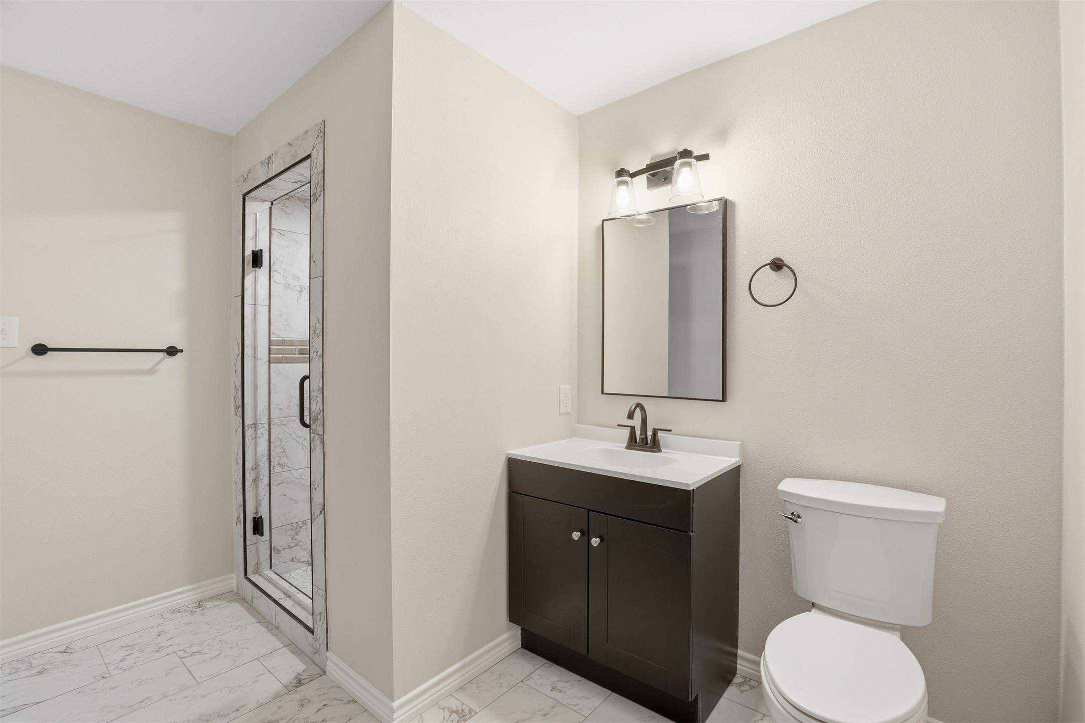 6518 Paris Street Houston, TX 77021 - Photo 22 of 23 a bathroom with a toilet sink and mirror
