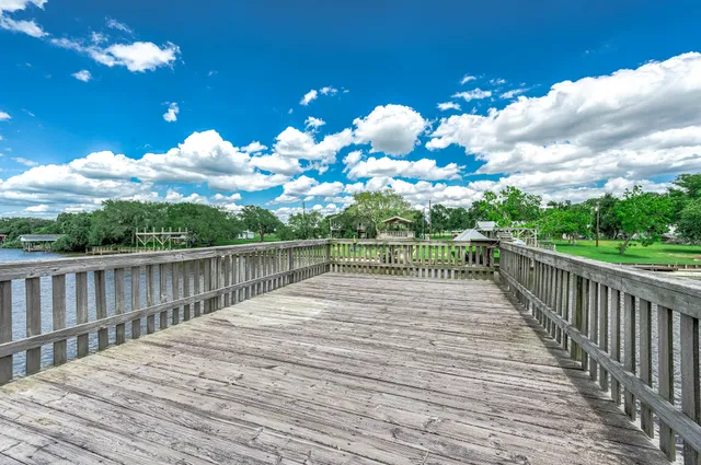a view of a balcony with wooden floor