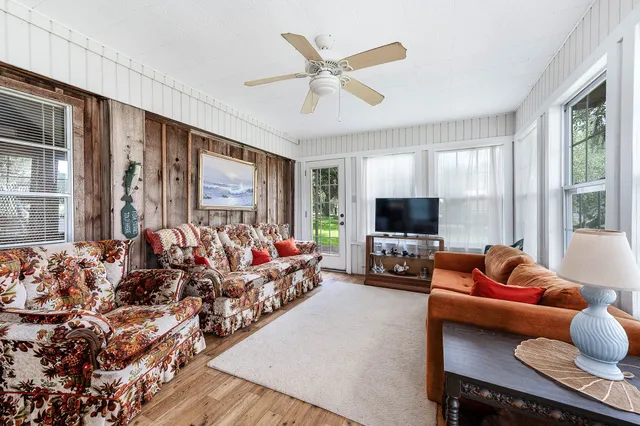 a view of hallway with livingroom and couch