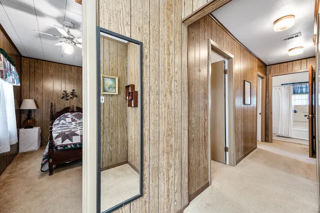 a bedroom with furniture and a window