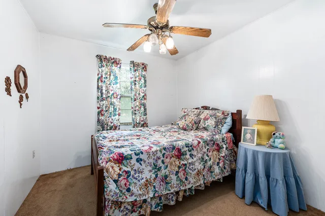 a bathroom with a bathtub sink vanity and mirror
