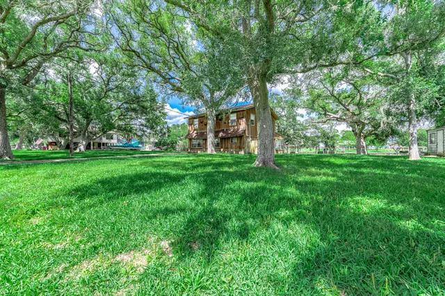 a backyard of a house with lots of green space