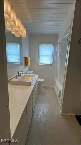 a view of a porch with chairs and backyard