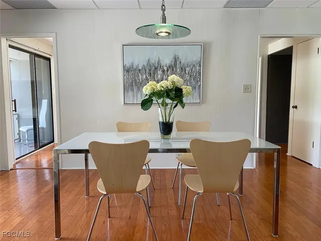 a view of a dining room with furniture and wooden floor