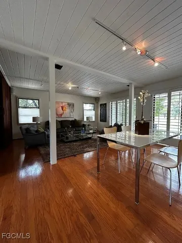a lobby with furniture and wooden floor