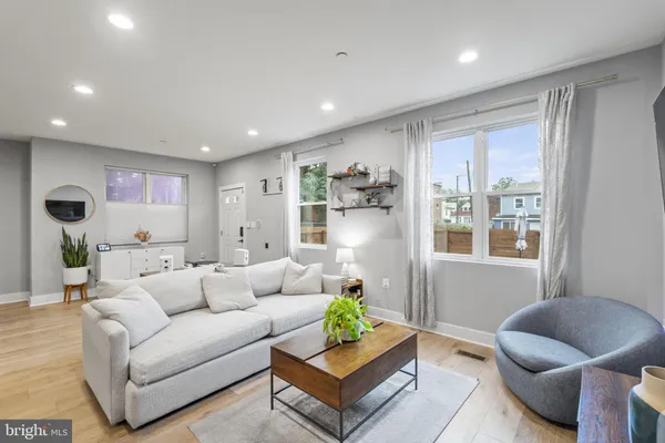 a living room with furniture and a large window