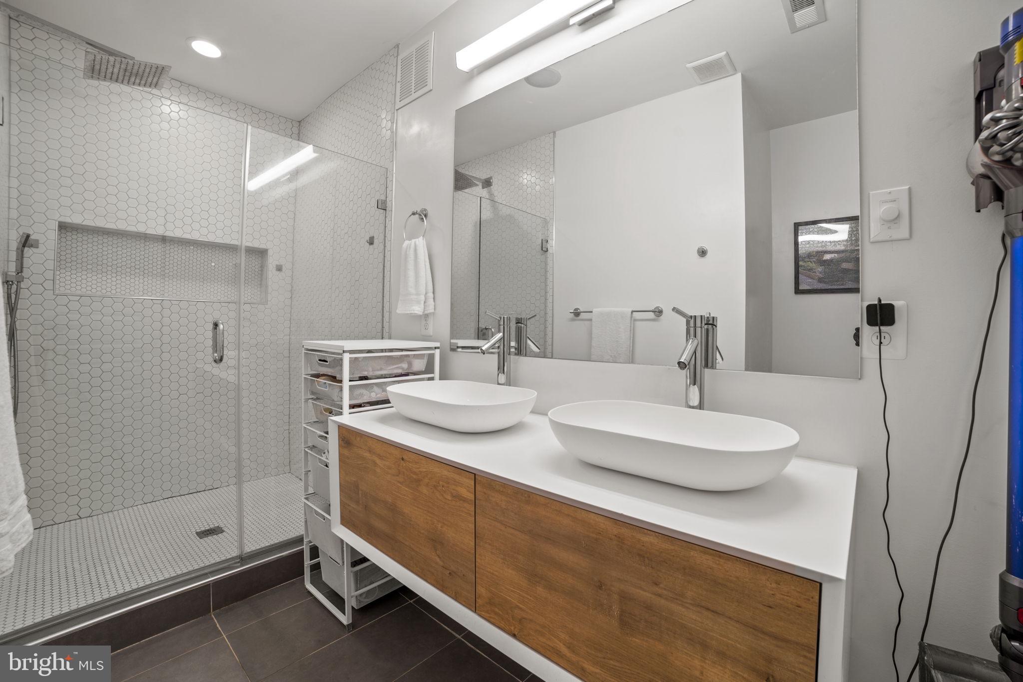 1838 Providence Street Northeast, Unit 2 Washington, DC 20002 - Photo 11 of 17 a bathroom with a sink double vanity and shower