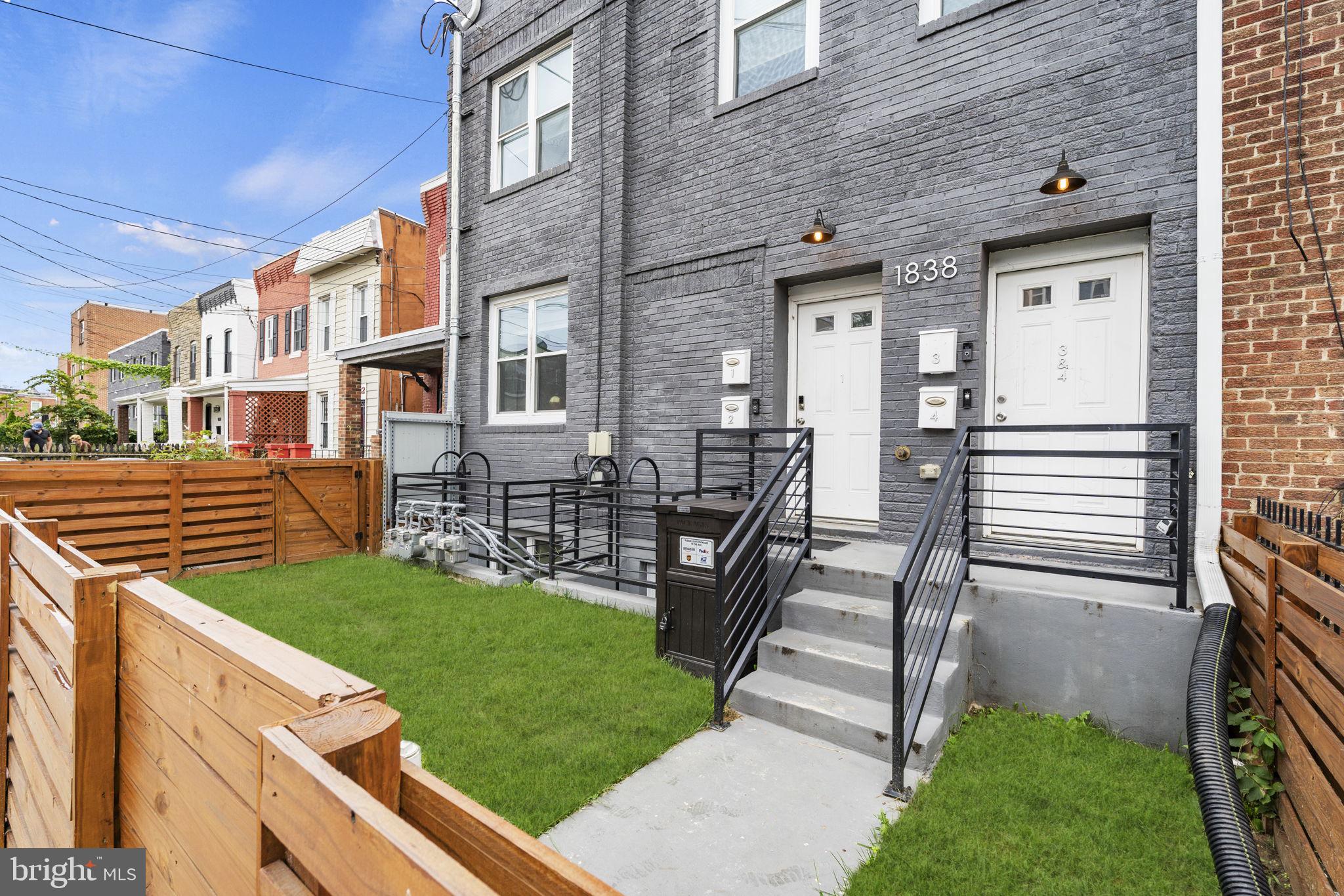 1838 Providence Street Northeast, Unit 2 Washington, DC 20002 - Photo 16 of 17 a front view of a house with a yard