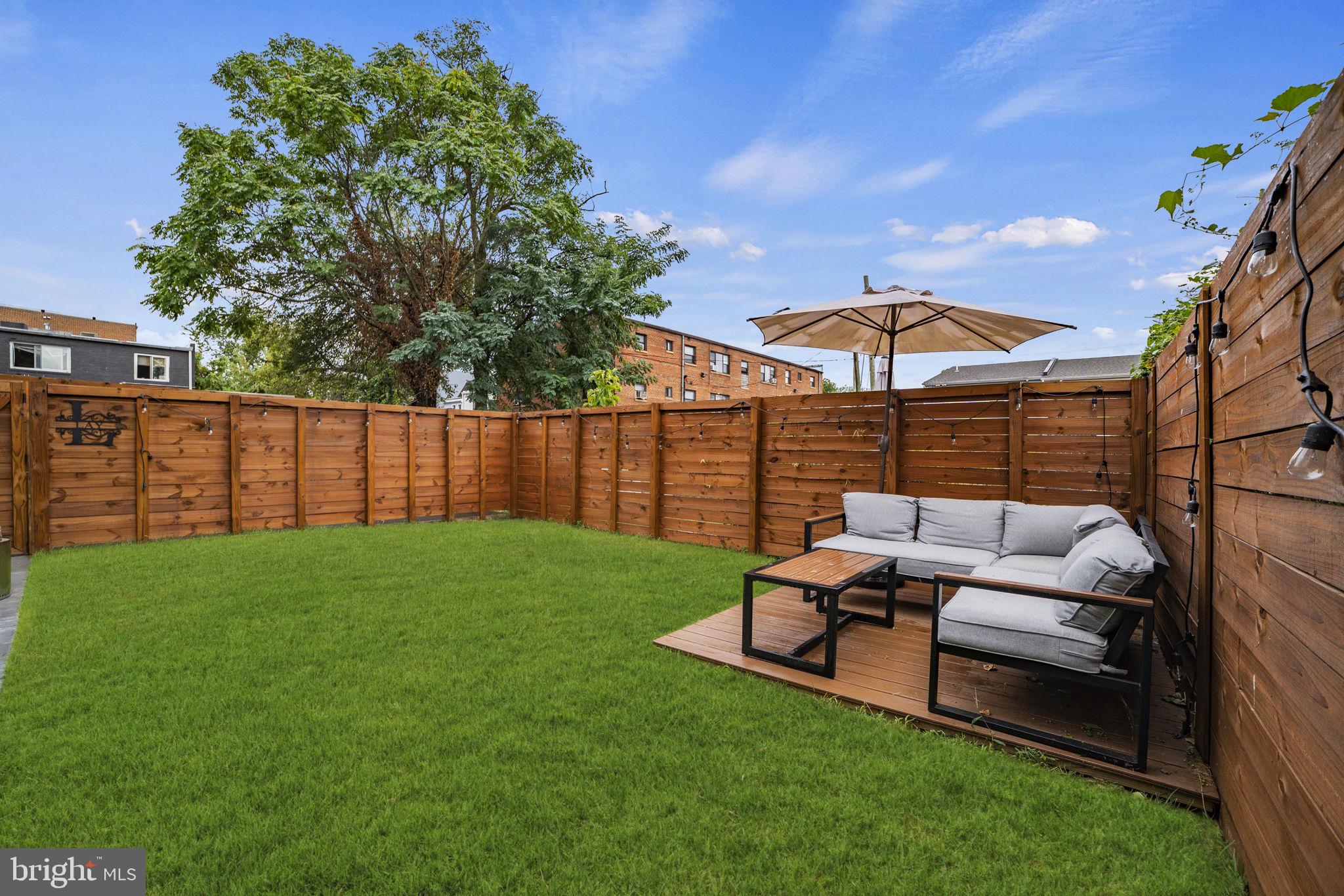 1838 Providence Street Northeast, Unit 2 Washington, DC 20002 - Photo 2 of 17 a view of a yard with furniture and a garden