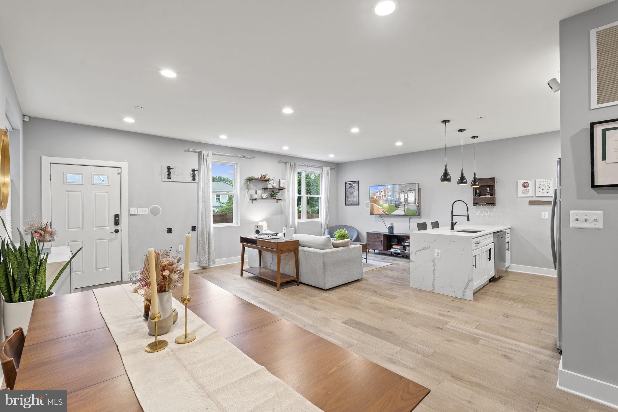 1838 Providence Street Northeast, Unit 2 Washington, DC 20002 - Photo 3 of 17 a living room with furniture and view of kitchen