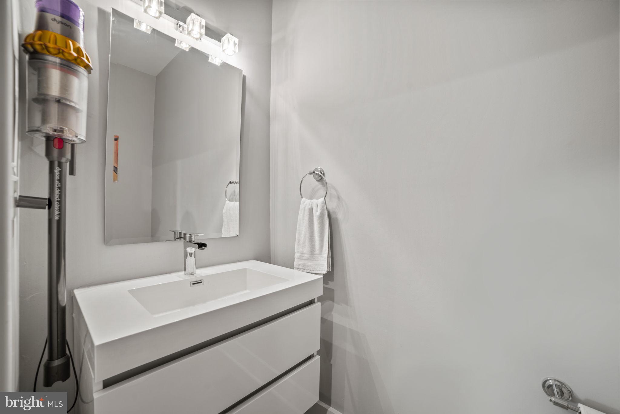 1838 Providence Street Northeast, Unit 2 Washington, DC 20002 - Photo 7 of 17 a bathroom with a sink and a mirror