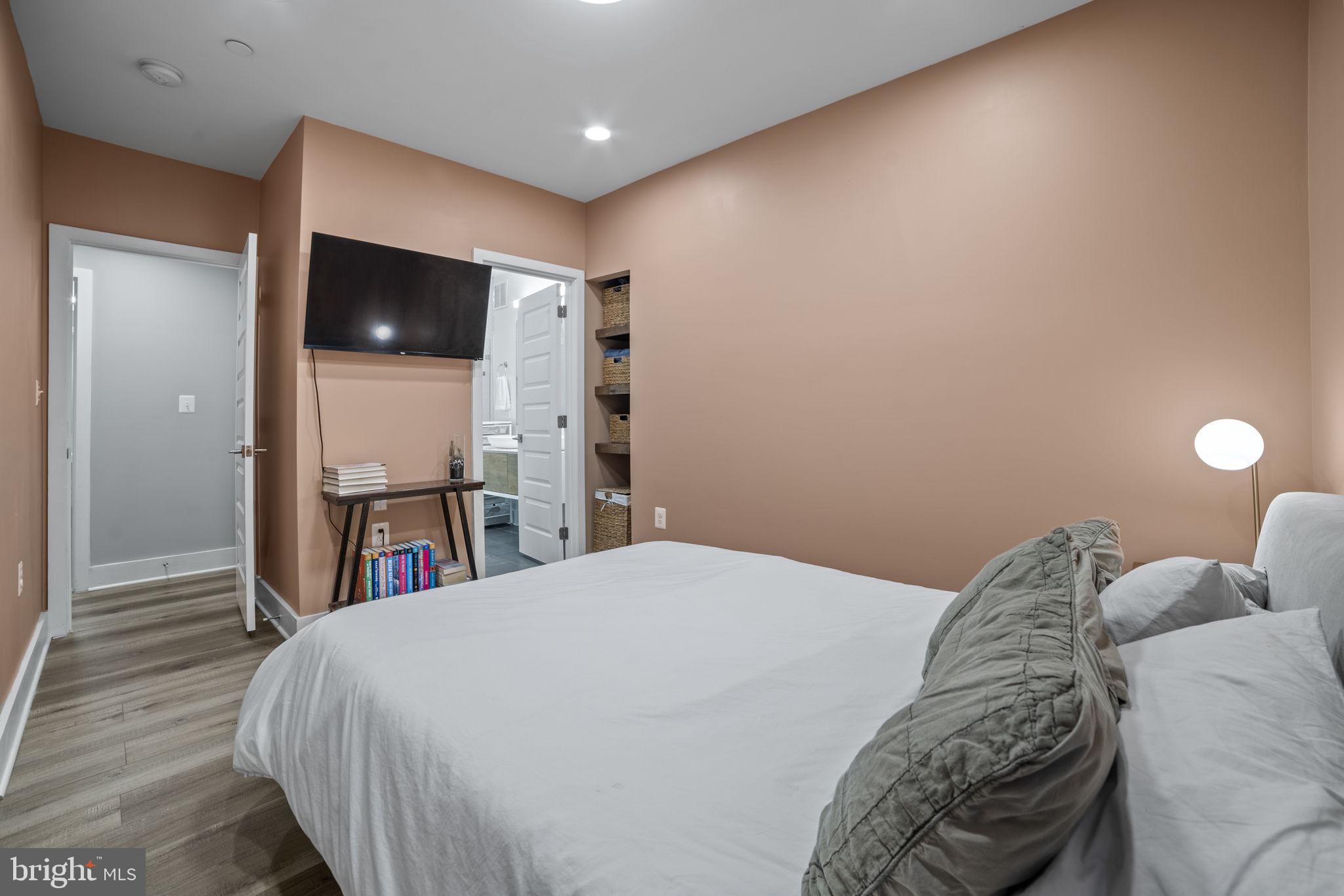 1838 Providence Street Northeast, Unit 2 Washington, DC 20002 - Photo 10 of 17 a bed room with a bed and a television