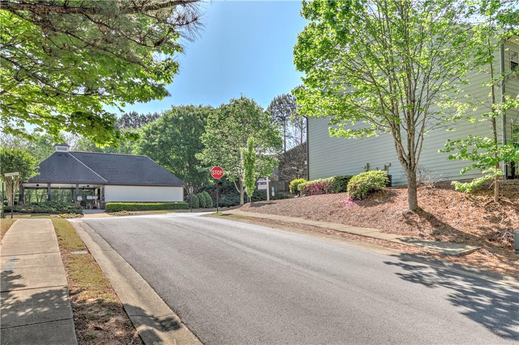 605 Summit Point Canton, GA 30114 - Photo 54 of 56 a front view of a house with a yard and a large tree
