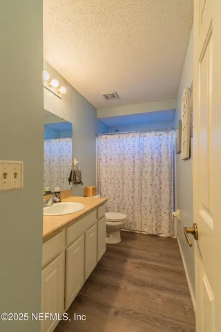 a room with furniture and a flat screen tv