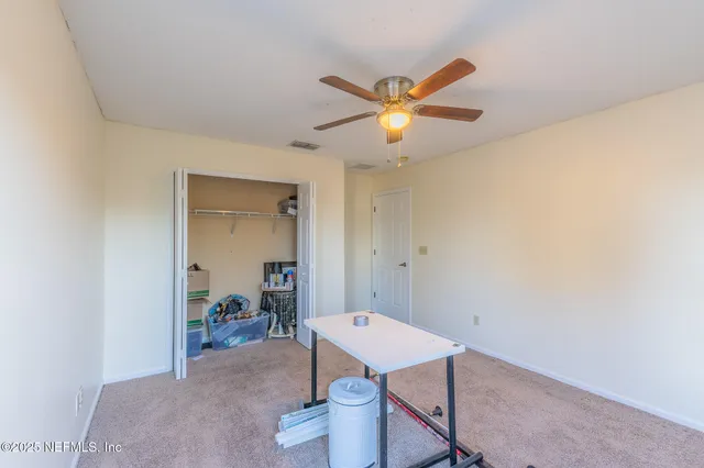 a view of a bedroom with furniture and toys