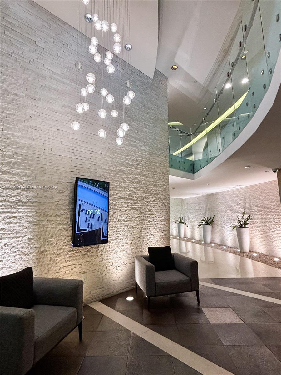 92 Southwest 3rd Street, Unit 4407 Miami, FL 33130 - Photo 18 of 21 a outdoor living space with furniture and a chandelier