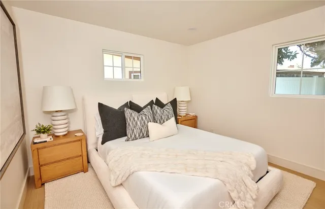 a bedroom with bed and window