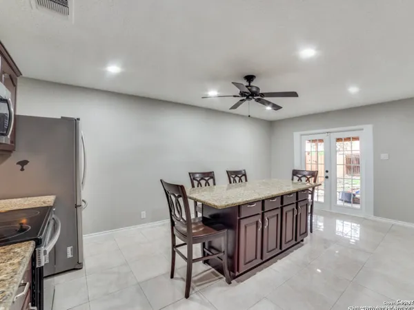 a dining room with furniture and window