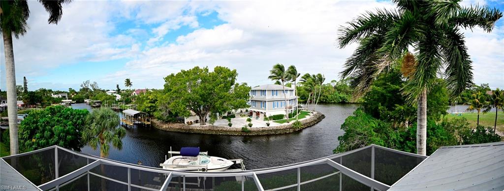 a table and chairs in a backyard of a house