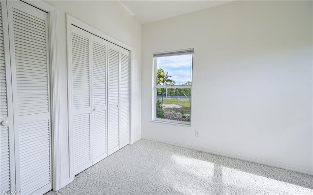 3858 Riviera Circle Bonita Springs, FL 34134 - Photo 13 of 34 an empty room with windows
