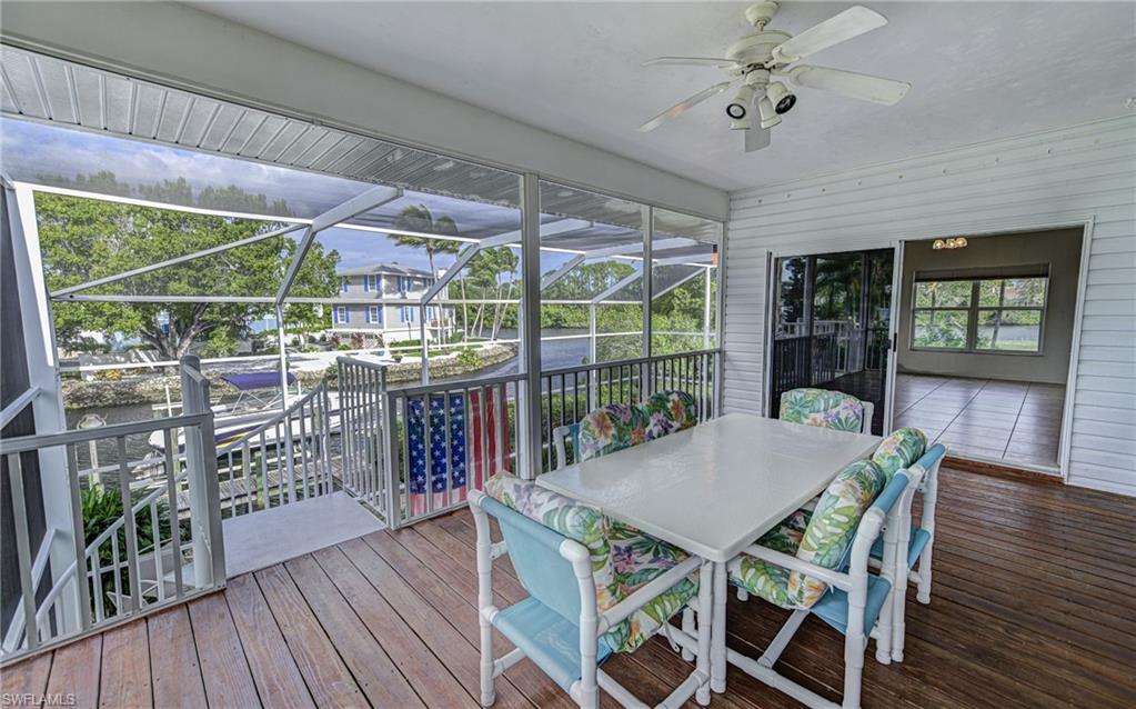 3858 Riviera Circle Bonita Springs, FL 34134 - Photo 15 of 34 a view of a dining room with furniture window and wooden floor