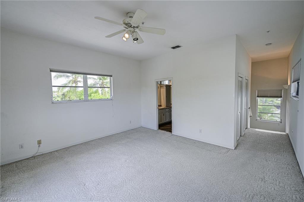 3858 Riviera Circle Bonita Springs, FL 34134 - Photo 20 of 34 an empty room with windows