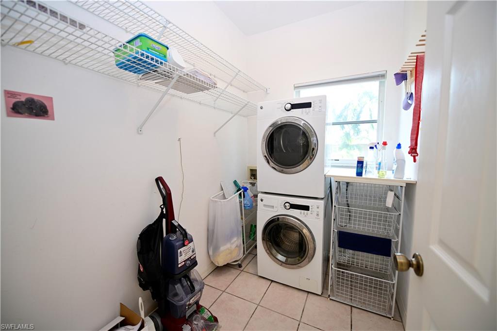 3858 Riviera Circle Bonita Springs, FL 34134 - Photo 21 of 34 a view of washer and dryer in a utility room