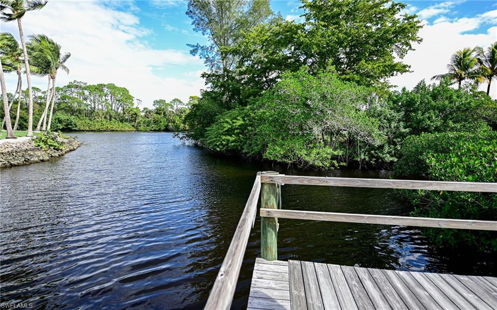 3858 Riviera Circle Bonita Springs, FL 34134 - Photo 30 of 34 a view of balcony with wooden floor and outdoor space