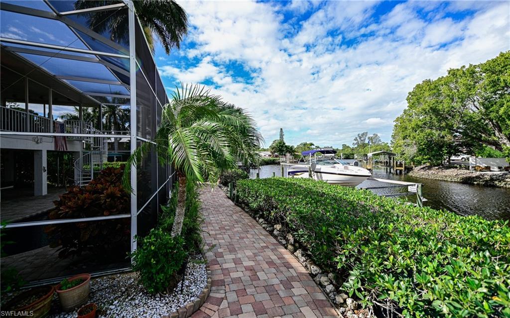 3858 Riviera Circle Bonita Springs, FL 34134 - Photo 33 of 34 a view of a water pond with lots of green space