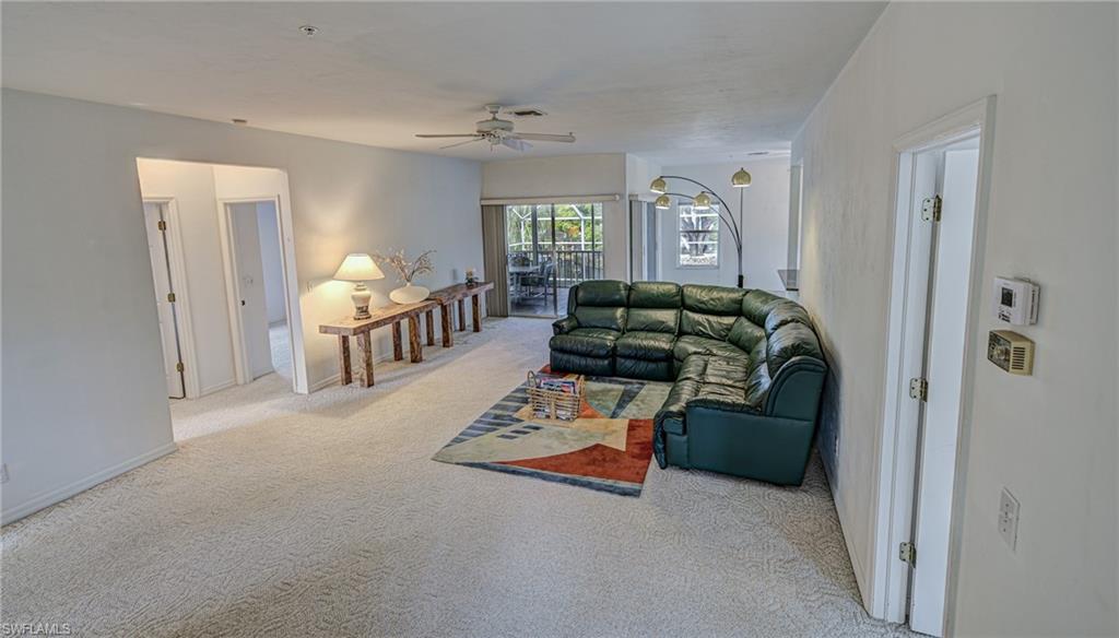 3858 Riviera Circle Bonita Springs, FL 34134 - Photo 4 of 34 a living room with furniture and a window