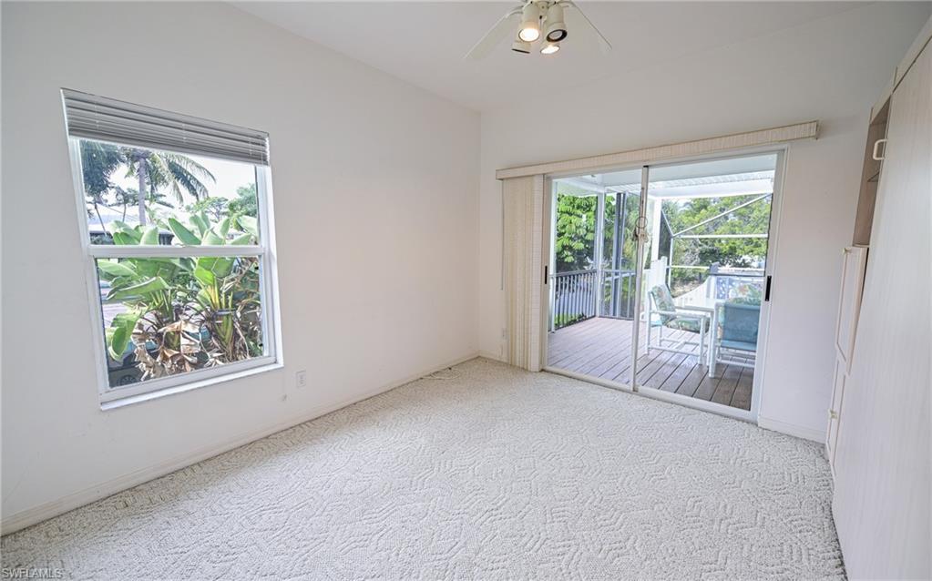 3858 Riviera Circle Bonita Springs, FL 34134 - Photo 9 of 34 a view of an empty room with a window